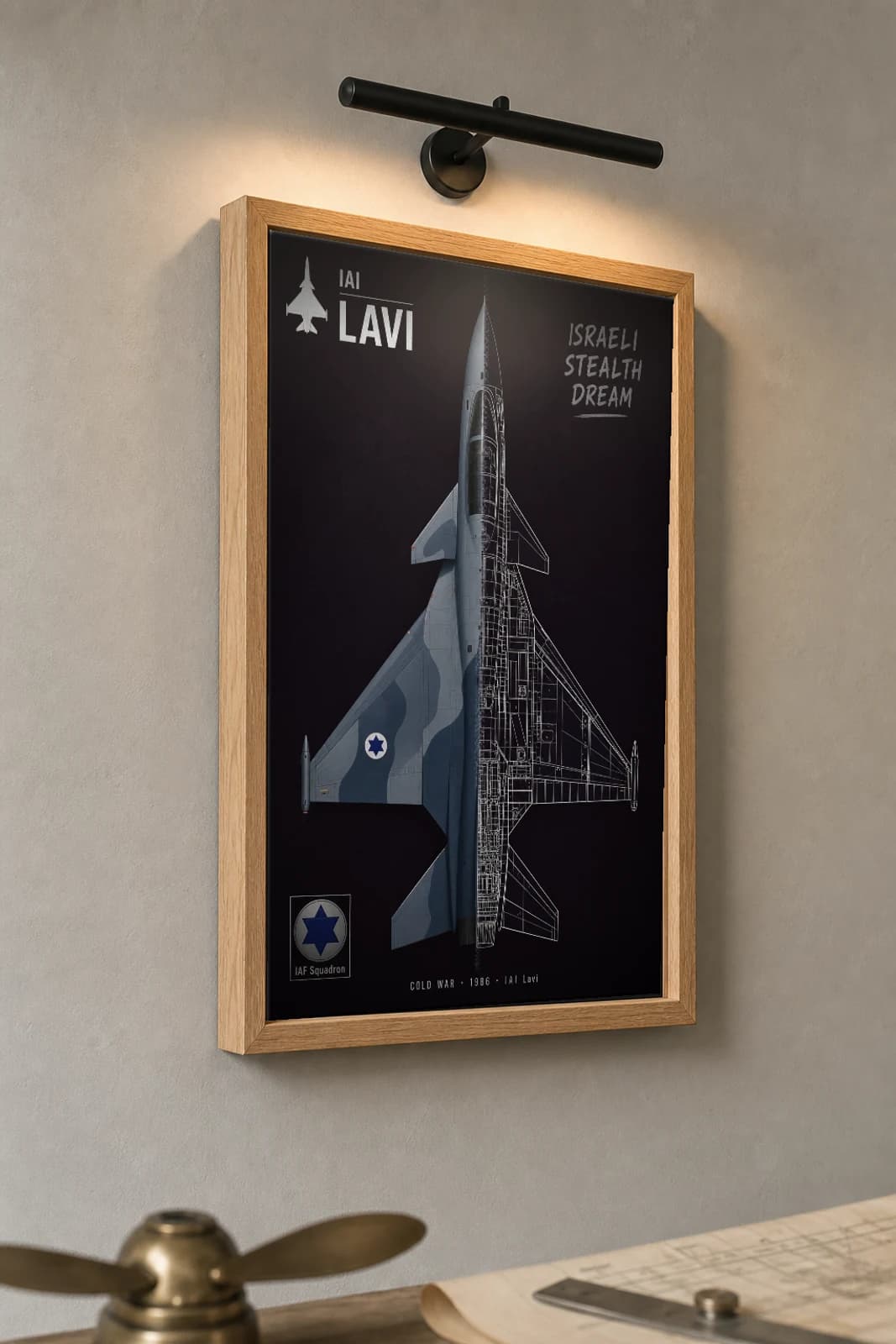 IAI Lavi Cutaway Poster — 1986 Canard-Delta Prototype Split-View Blueprint Print — the framed print shown at a three-quarter angle on a styled gallery wall in a natural-oak frame