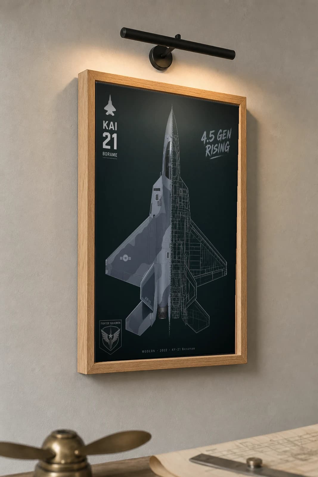 KF-21 Boramae Cutaway Poster — Block 1 Modern Split-View Blueprint Print — the framed print shown at a three-quarter angle on a styled gallery wall in a natural-oak frame