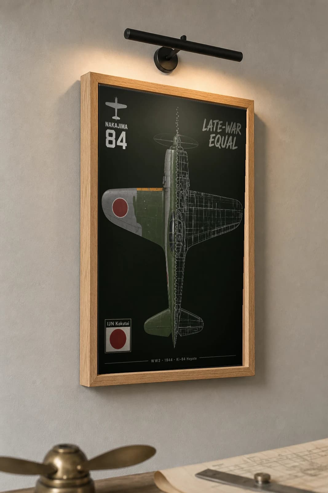 Ki-84 Hayate Cutaway Poster — Ki-84 Ko WW2 Split-View Blueprint Print — the framed print shown at a three-quarter angle on a styled gallery wall in a natural-oak frame