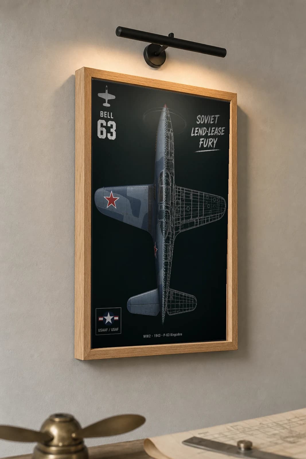 P-63 Kingcobra Cutaway Poster — P-63A WW2 Split-View Blueprint Print — the framed print shown at a three-quarter angle on a styled gallery wall in a natural-oak frame