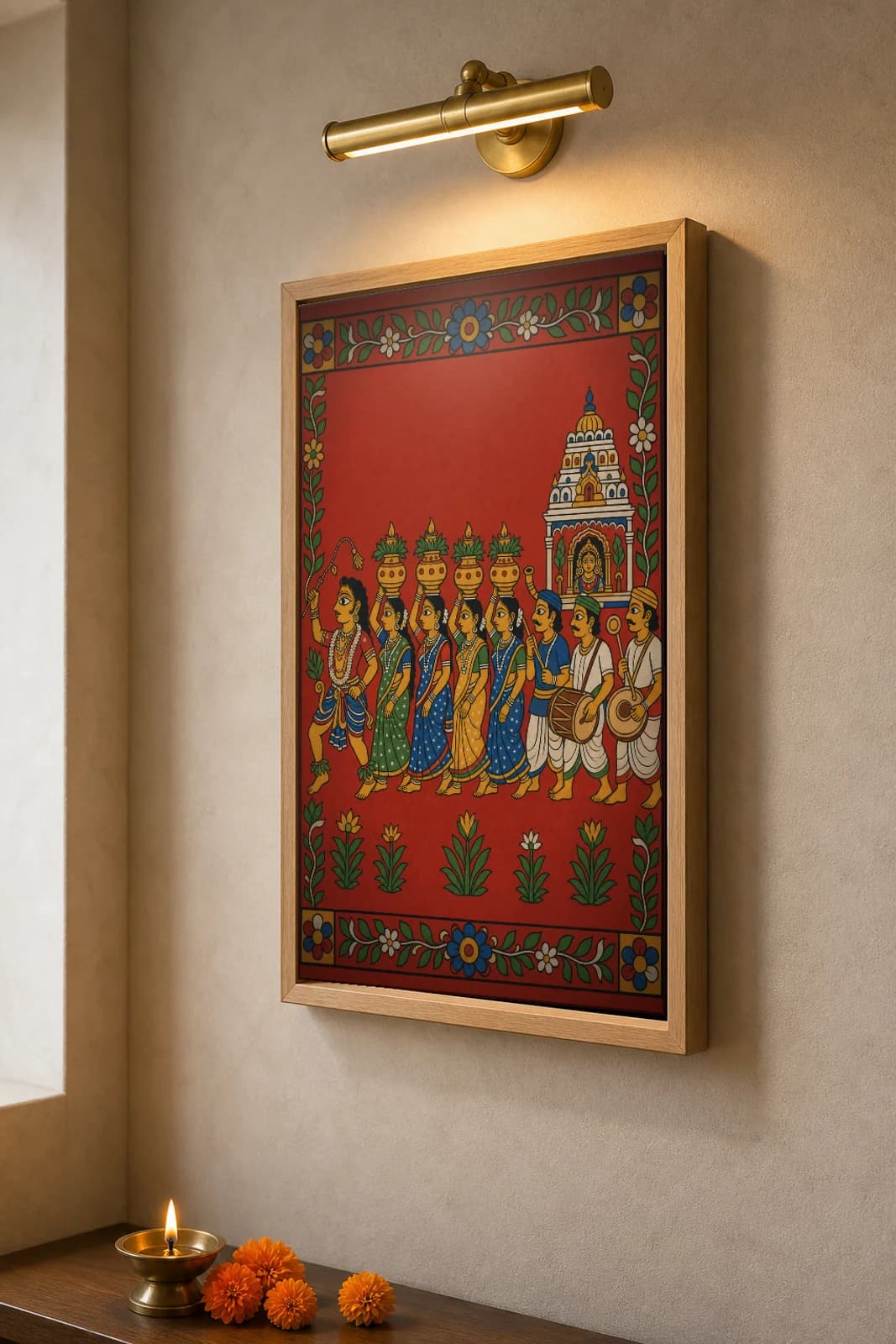 Bonalu Cheriyal Fusion Print — Telangana's Mahankali Pot Procession Led by a Pothuraju Dancer, Nakashi Folk Grammar on a Vermilion Ground — the framed print shown at a three-quarter angle on a styled gallery wall in a natural-oak frame