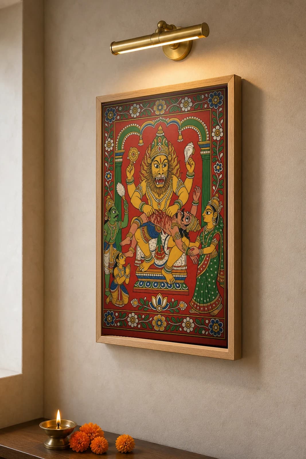 Lakshmi Narasimha Cheriyal Scroll Print — The Man-Lion Avatar Slaying Hiranyakashipu at the Threshold, Nakashi Folk Grammar on a Vermilion Ground — the framed print shown at a three-quarter angle on a styled gallery wall in a natural-oak frame