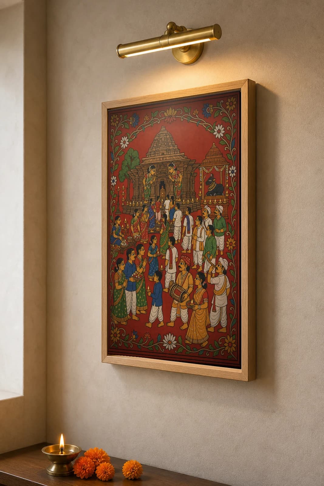 Ramappa Temple Festival Cheriyal Print — lamp-lit devotees before the Kakatiya stone temple and Nandi shrine · collector edition on vermilion ground · Nakashi scroll grammar from Telangana — the framed print shown at a three-quarter angle on a styled gallery wall in a natural-oak frame