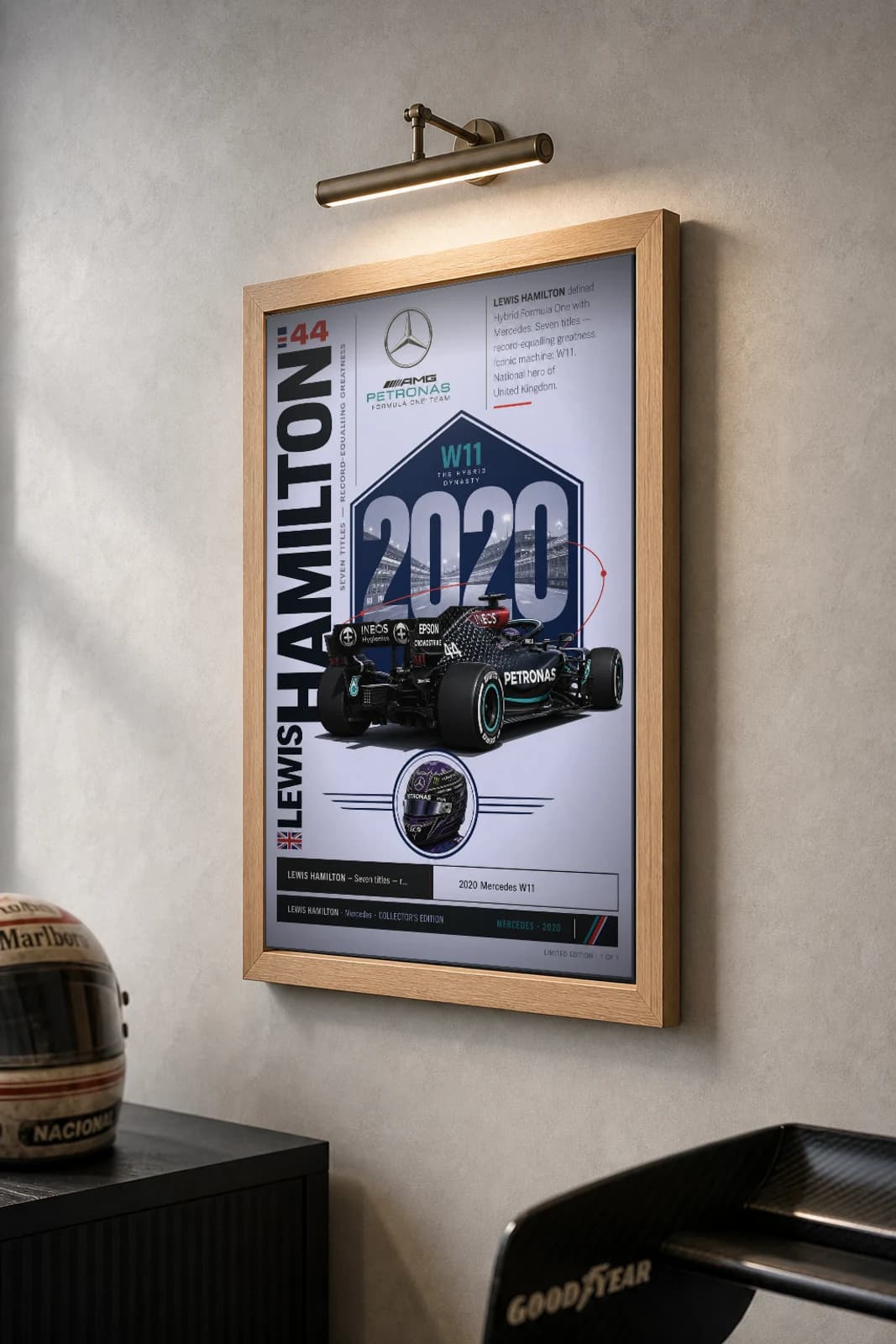 Lewis Hamilton Poster — 2020 Mercedes W11 Hybrid F1 Heritage Collector Print — the framed print shown at a three-quarter angle on a styled gallery wall in a natural-oak frame