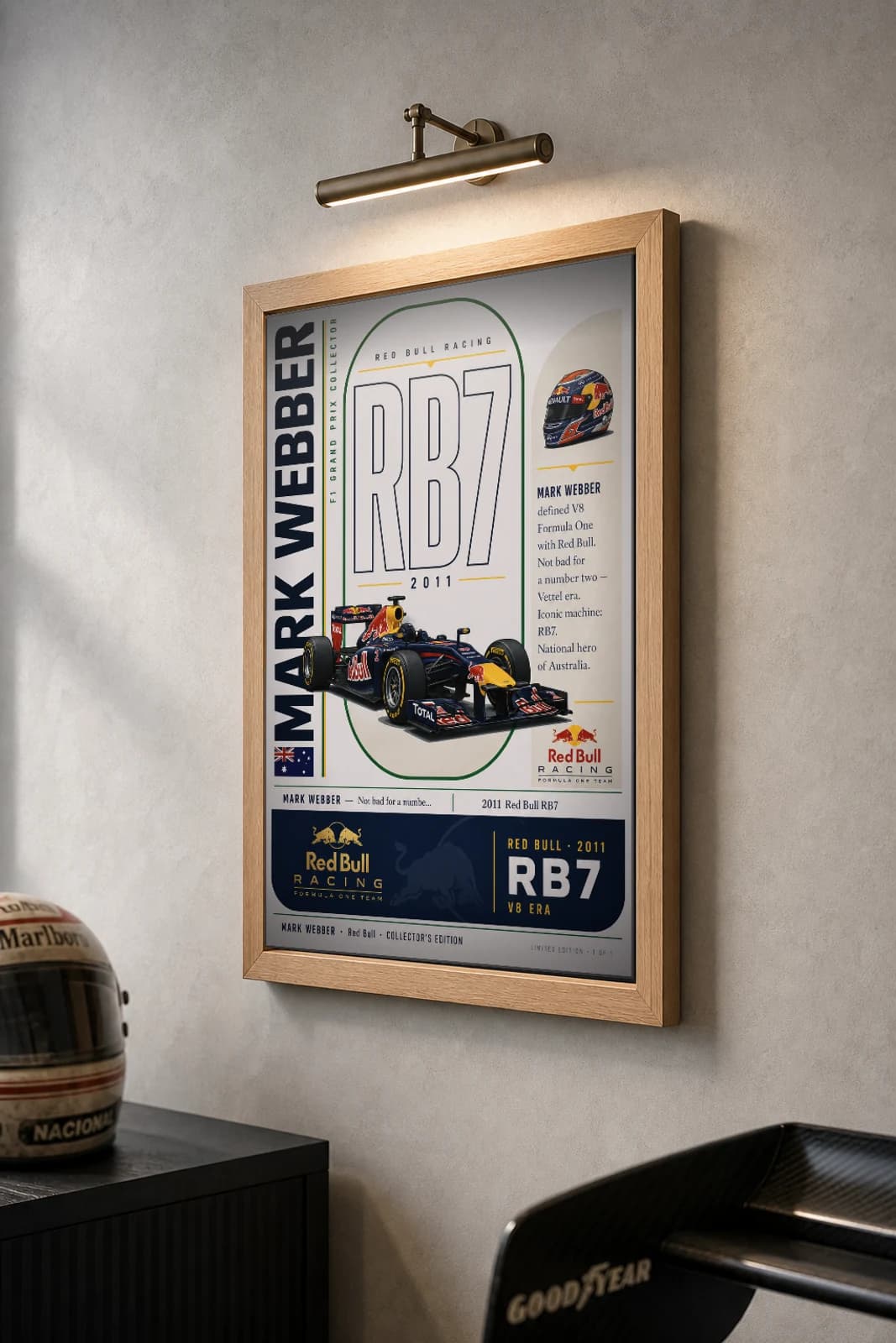 Mark Webber Poster — 2011 Red Bull RB7 V8 F1 Heritage Collector Print — the framed print shown at a three-quarter angle on a styled gallery wall in a natural-oak frame