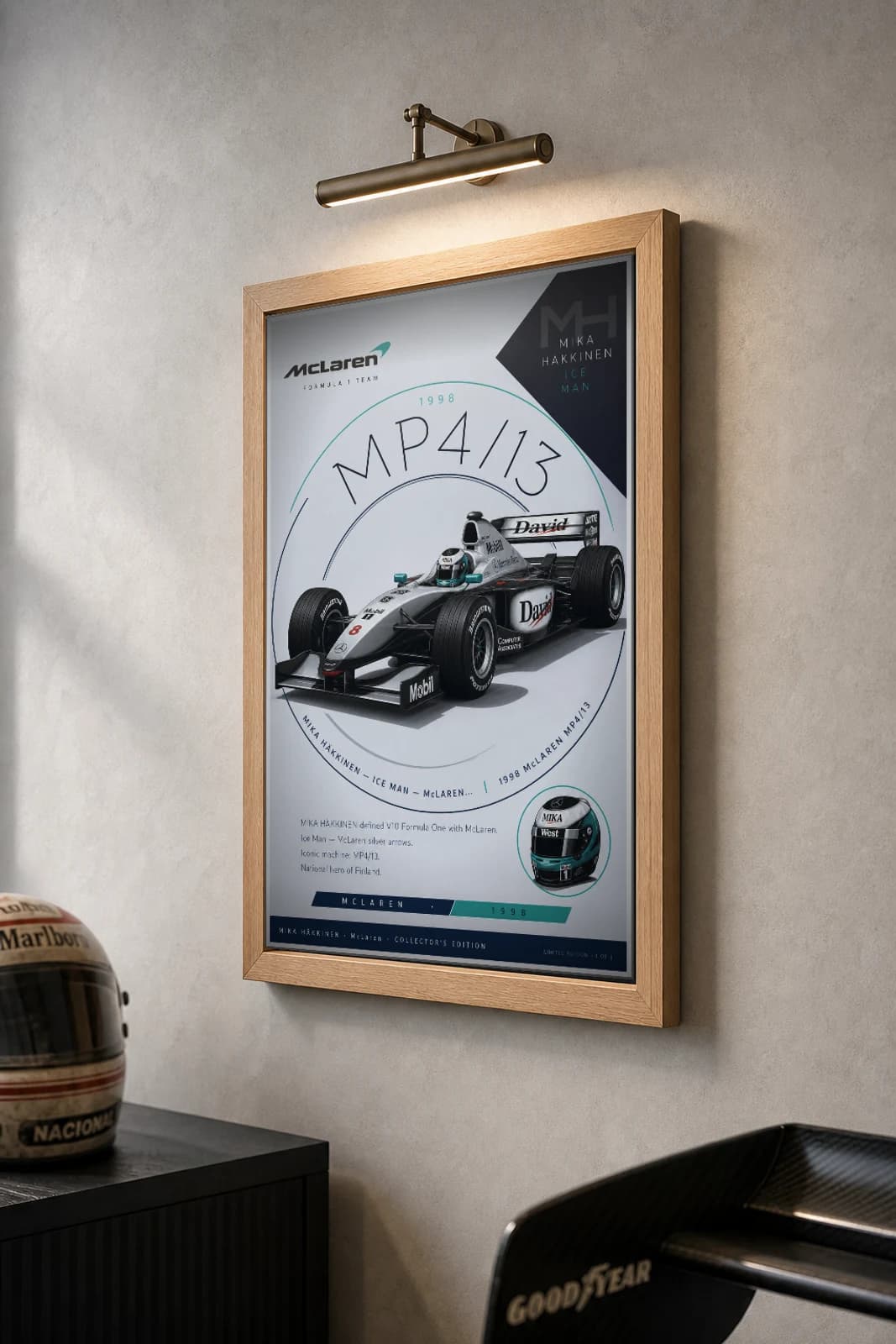 Mika Häkkinen Poster — 1998 McLaren MP4/13 V10 F1 Heritage Collector Print — the framed print shown at a three-quarter angle on a styled gallery wall in a natural-oak frame