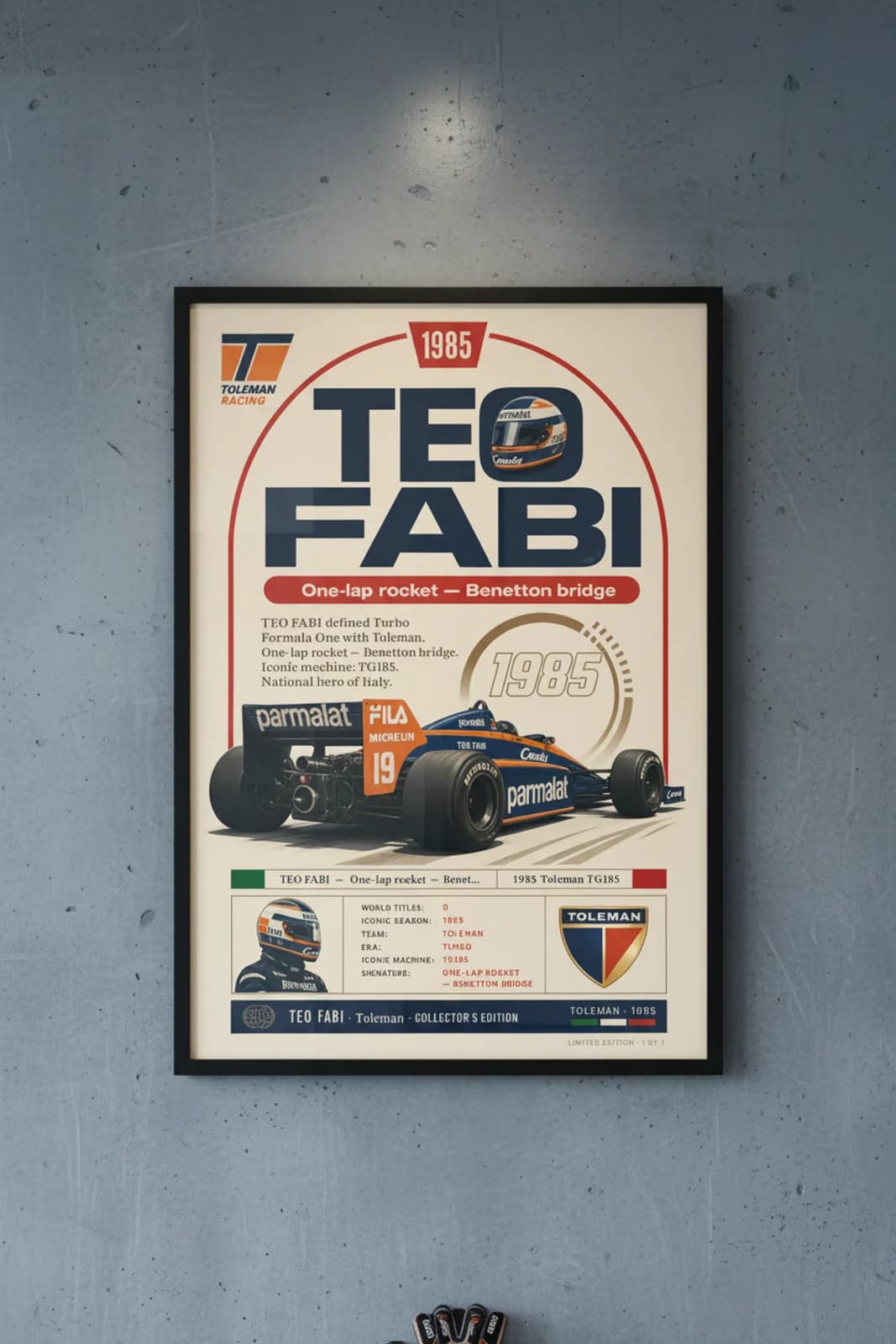 Teo Fabi poster in black A2 frame on toleman-blue-orange polished concrete wall — F1 heritage collector mockup