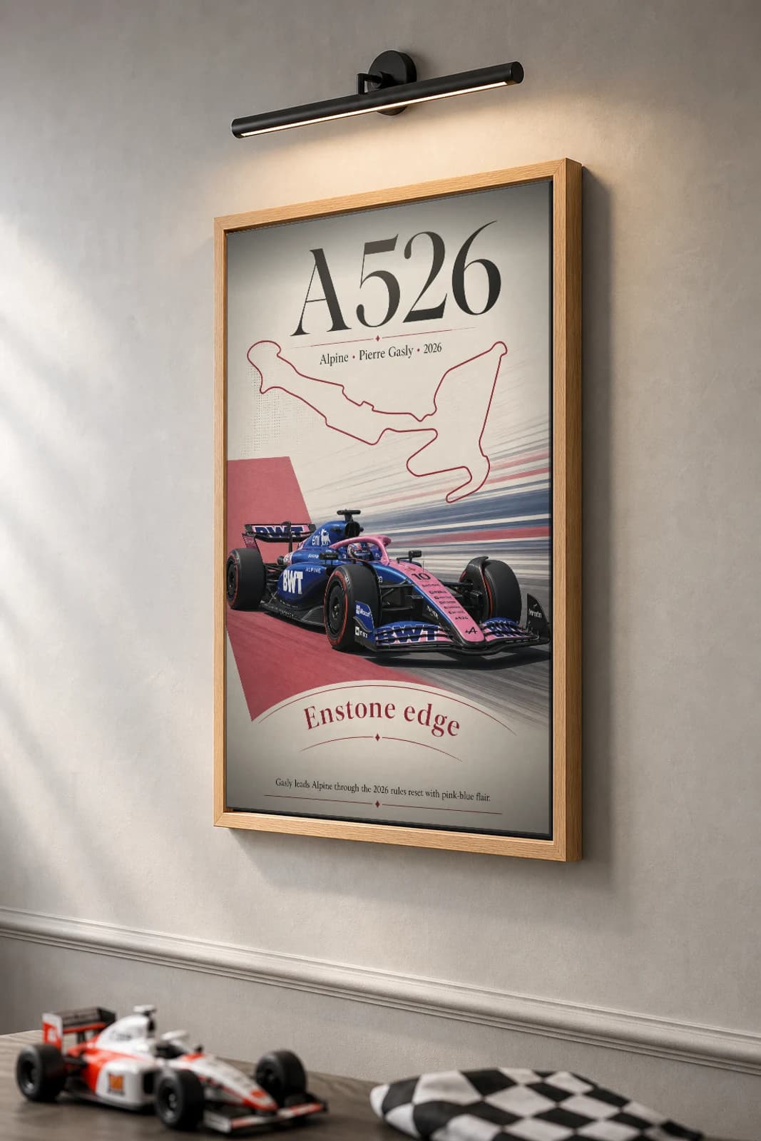 Alpine F1 Team A526 — Pierre Gasly Poster — undefined F1 Grid Editorial Wall Art · framed A2 — the framed print shown at a three-quarter angle on a styled gallery wall in a natural-oak frame