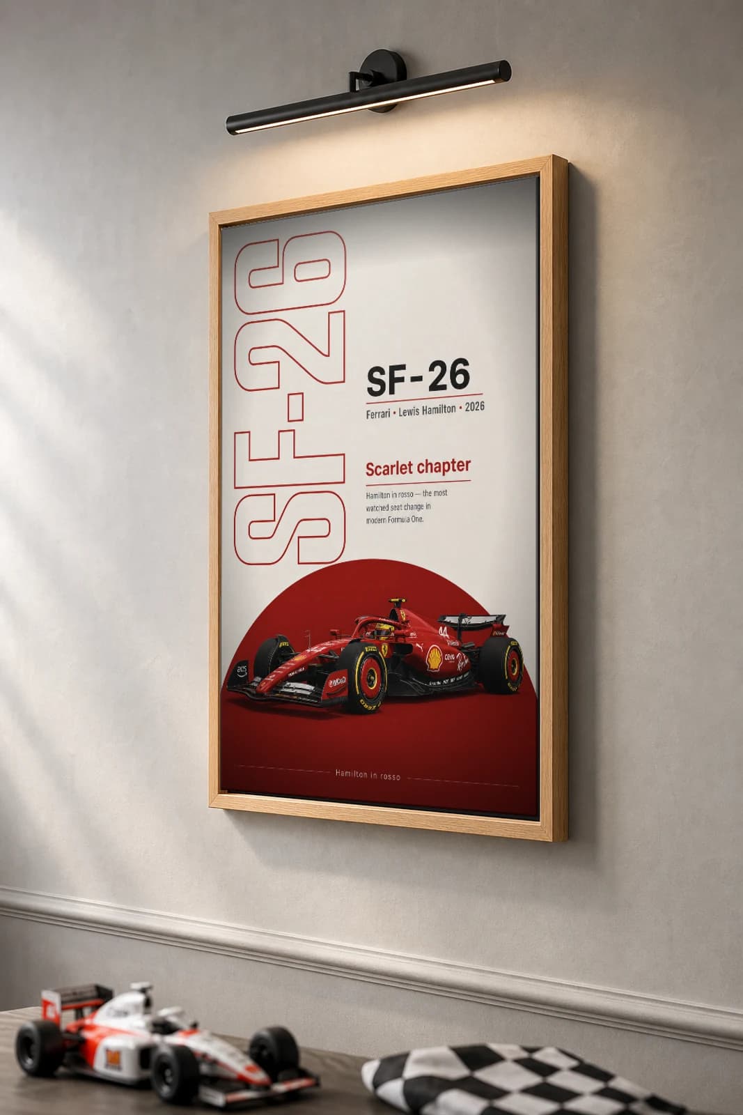 Ferrari SF-26 — Lewis Hamilton Poster — undefined F1 Grid Editorial Wall Art · framed A2 — the framed print shown at a three-quarter angle on a styled gallery wall in a natural-oak frame