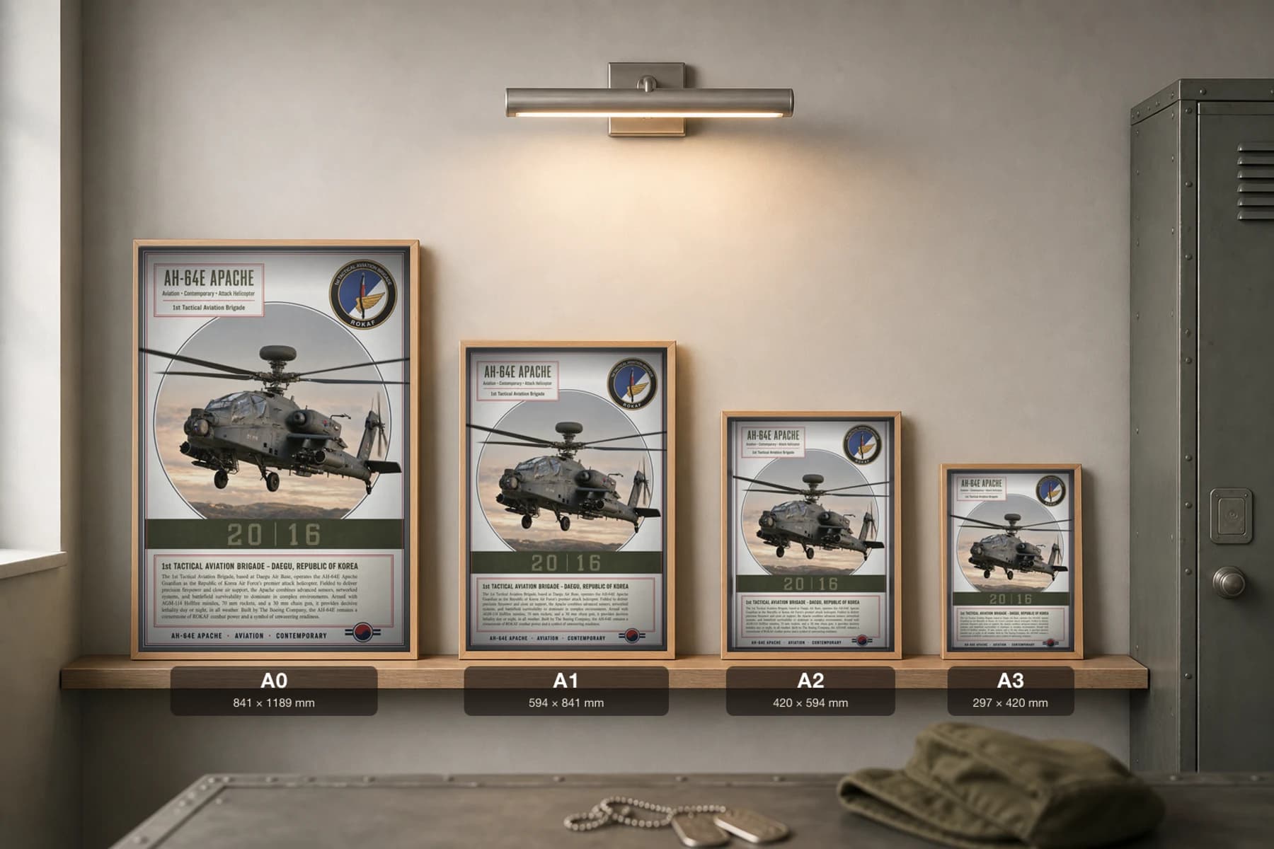 AH-64E Apache Poster — 1st Tactical Aviation Brigade military aviation wall art · framed A2 · 2016 — print size guide showing the artwork at A0, A1, A2 and A3 in natural-oak frames at true relative scale