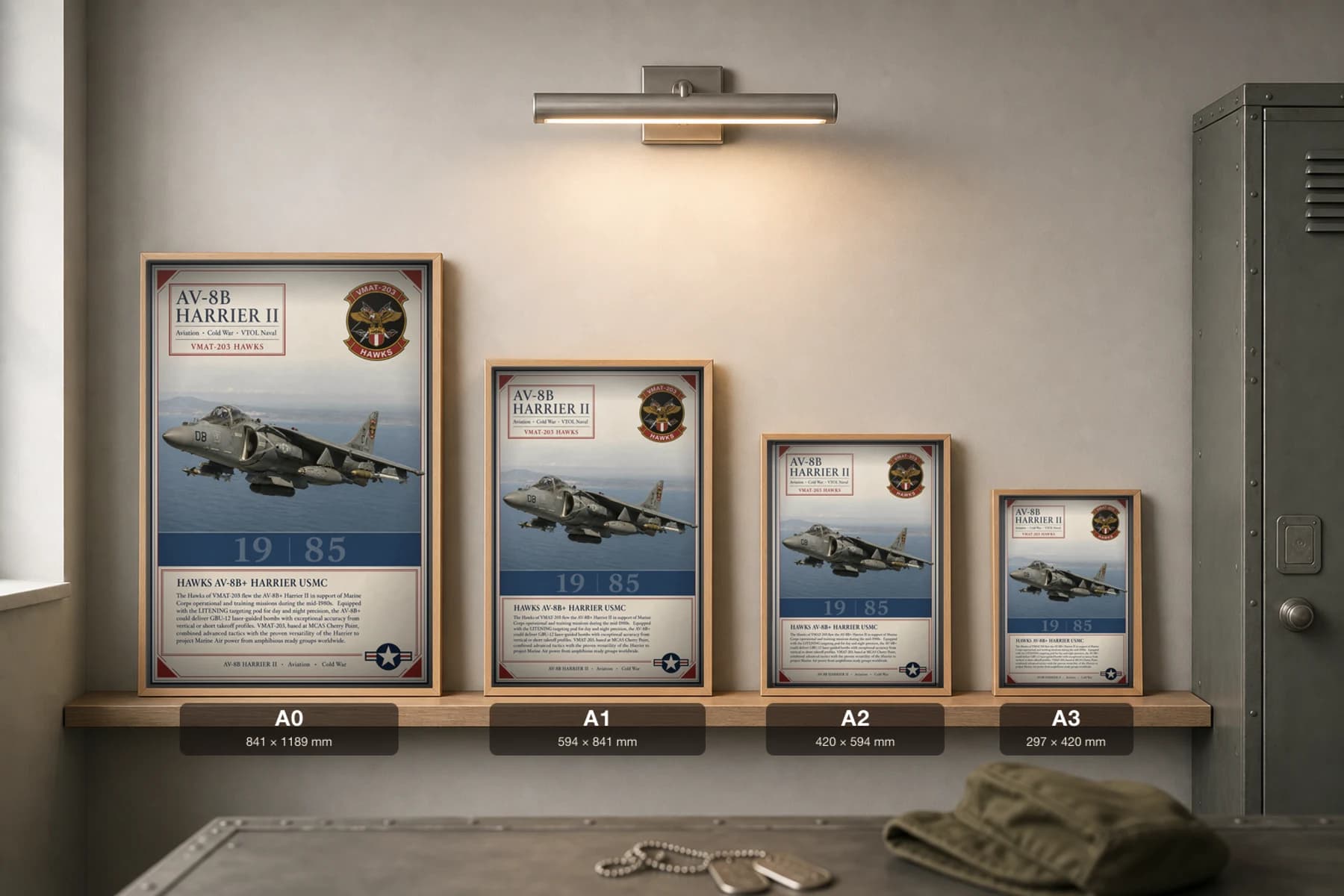 AV-8B Harrier II Poster — VMAT-203 Hawks military aviation wall art · framed A2 · 1985 — print size guide showing the artwork at A0, A1, A2 and A3 in natural-oak frames at true relative scale