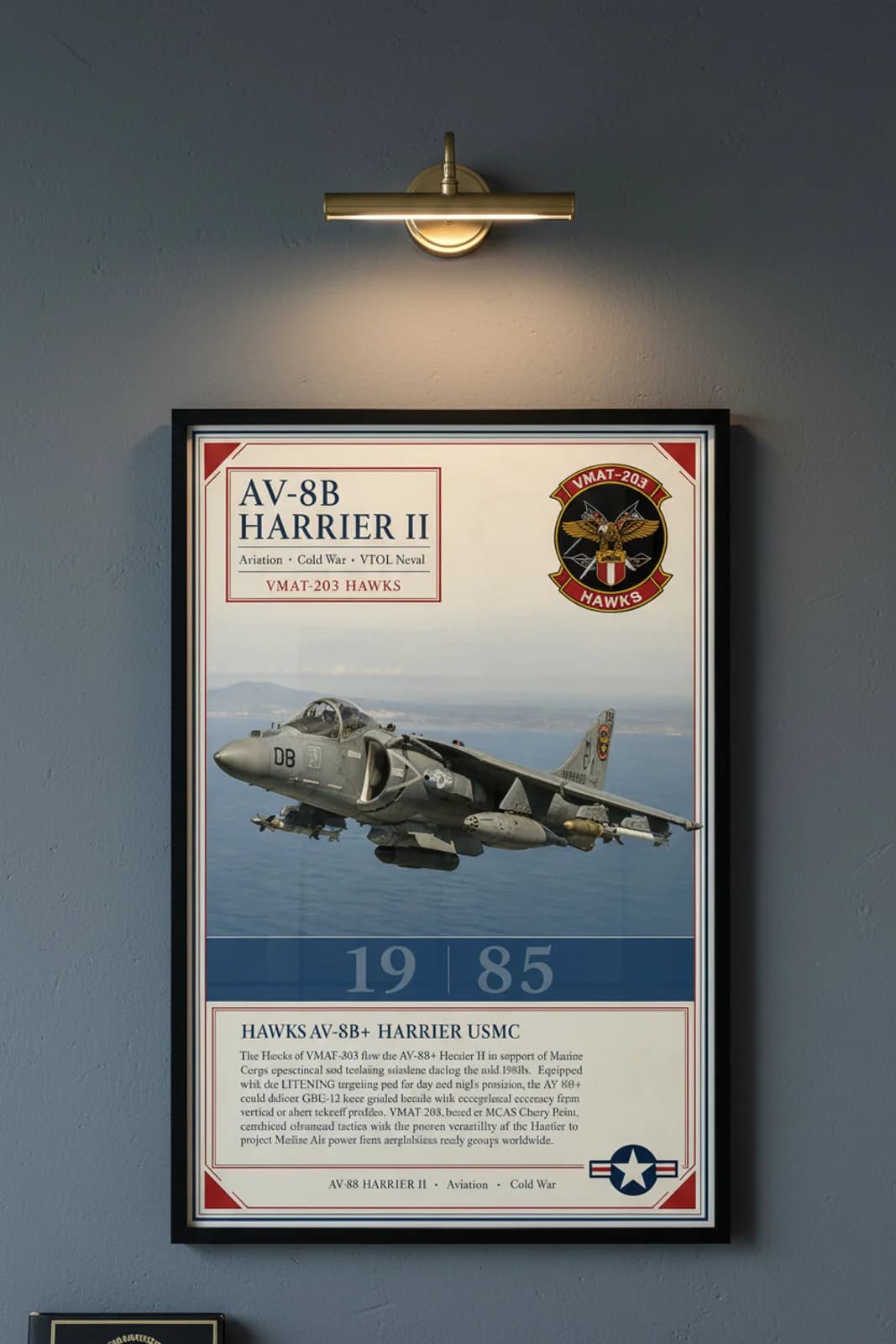 AV-8B Harrier II aviation poster in black A2 frame on tactical-grey navy hangar wall — Aviation Heroes mockup