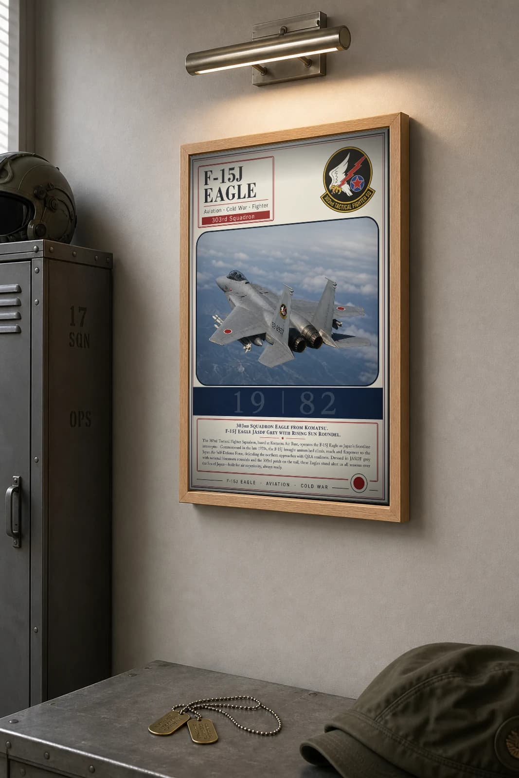 F-15J Eagle Poster — 303rd Tactical Fighter Squadron military aviation wall art · framed A2 · 1982 — the framed print shown at a three-quarter angle on a styled gallery wall in a natural-oak frame