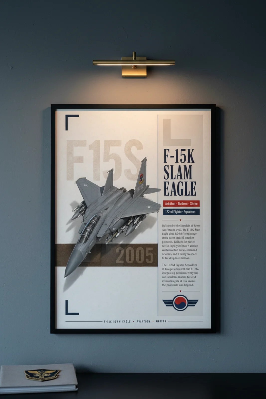 F-15K Slam Eagle aviation poster in black A2 frame on low-visibility-grey navy hangar wall — Aviation Heroes mockup