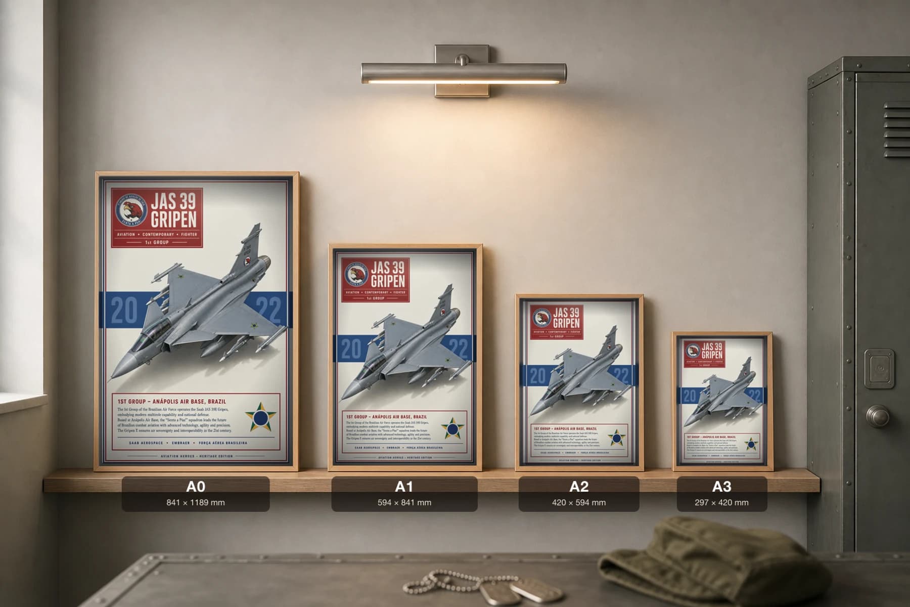 JAS 39 Gripen E Poster — 1st Group military aviation wall art · framed A2 · 2022 — print size guide showing the artwork at A0, A1, A2 and A3 in natural-oak frames at true relative scale