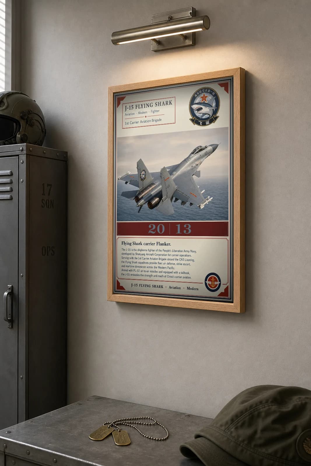 J-15 Flying Shark Poster — 1st Carrier Aviation Brigade military aviation wall art · framed A2 · 2013 — the framed print shown at a three-quarter angle on a styled gallery wall in a natural-oak frame