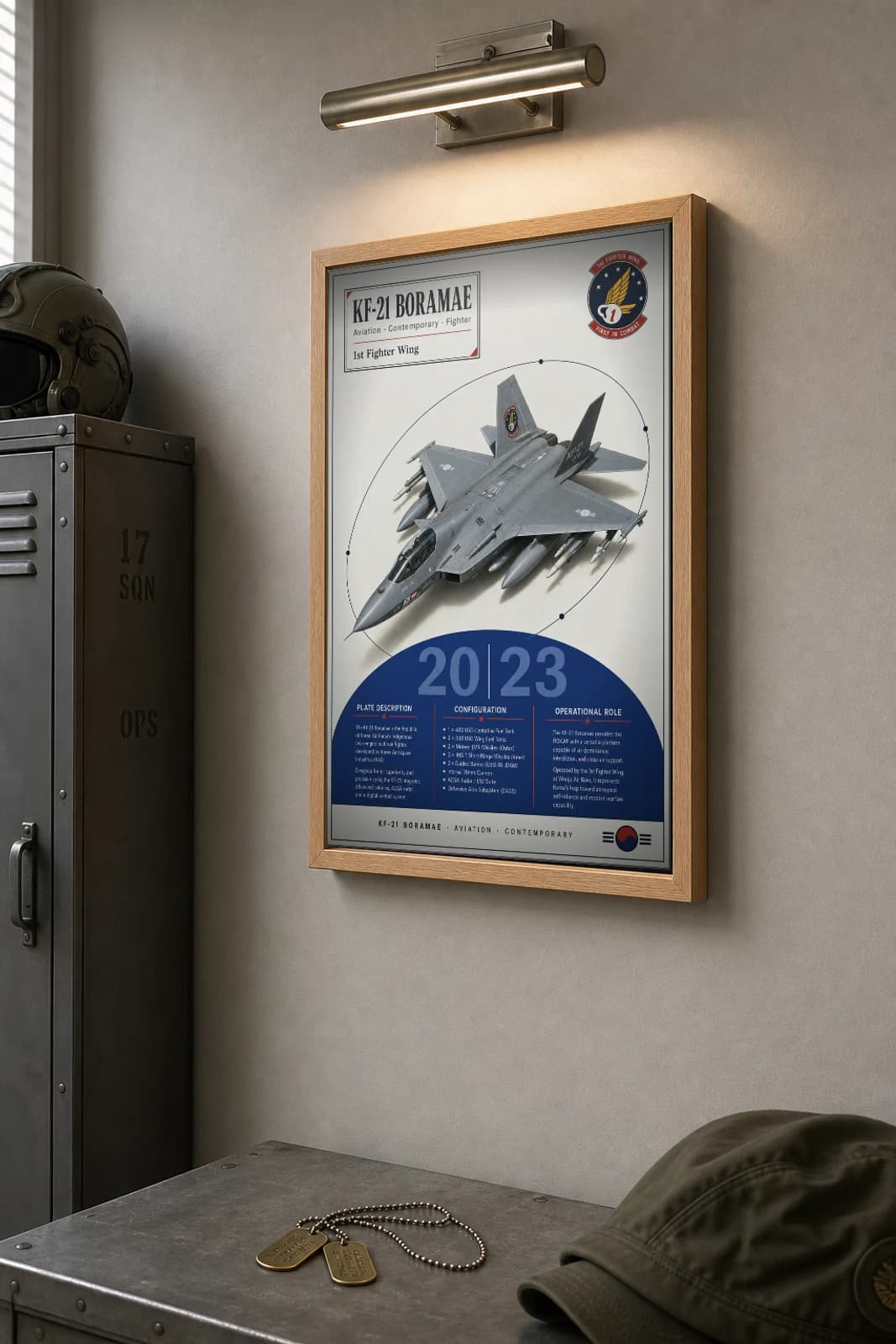 KF-21 Boramae Poster — 1st Fighter Wing military aviation wall art · framed A2 · 2023 — the framed print shown at a three-quarter angle on a styled gallery wall in a natural-oak frame