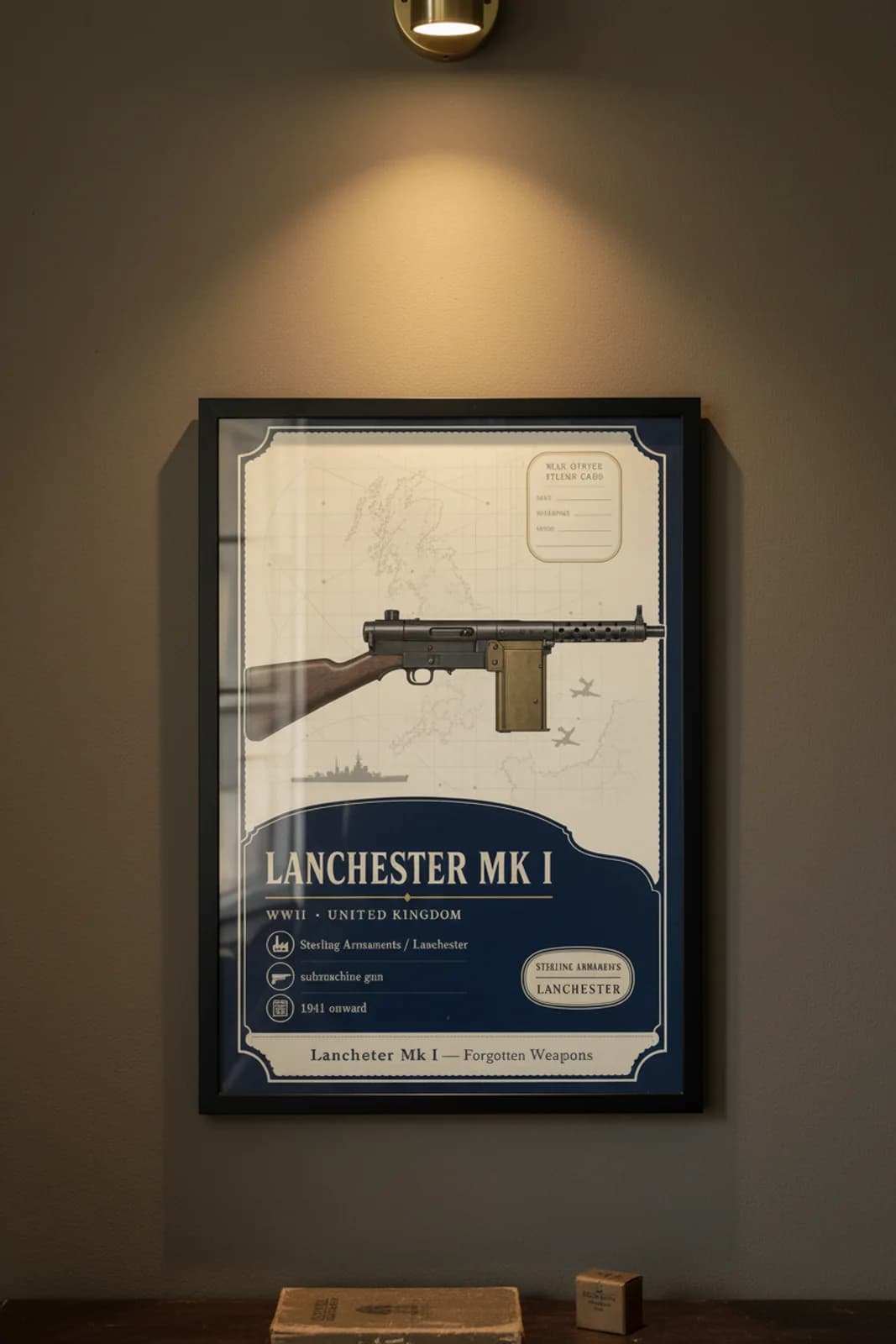 Lanchester Mk I — Forgotten Weapons poster in black A2 frame on lanchester-mk-i-armoury-wash armoury plaster wall — Forgotten Weapons study mockup