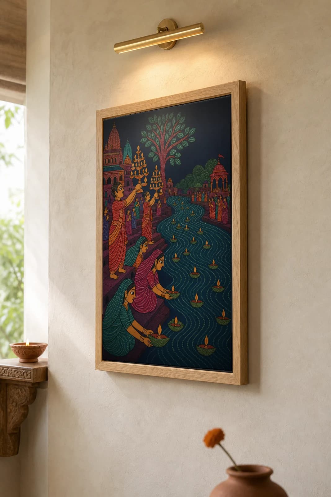 Narmada Ghat Aarti Gond Art Print — Pradhan Gond Jangarh Kalam folk art · collector A2 · Madhya Pradesh riverside diya offering at dusk — the framed print shown at a three-quarter angle on a styled gallery wall in a natural-oak frame