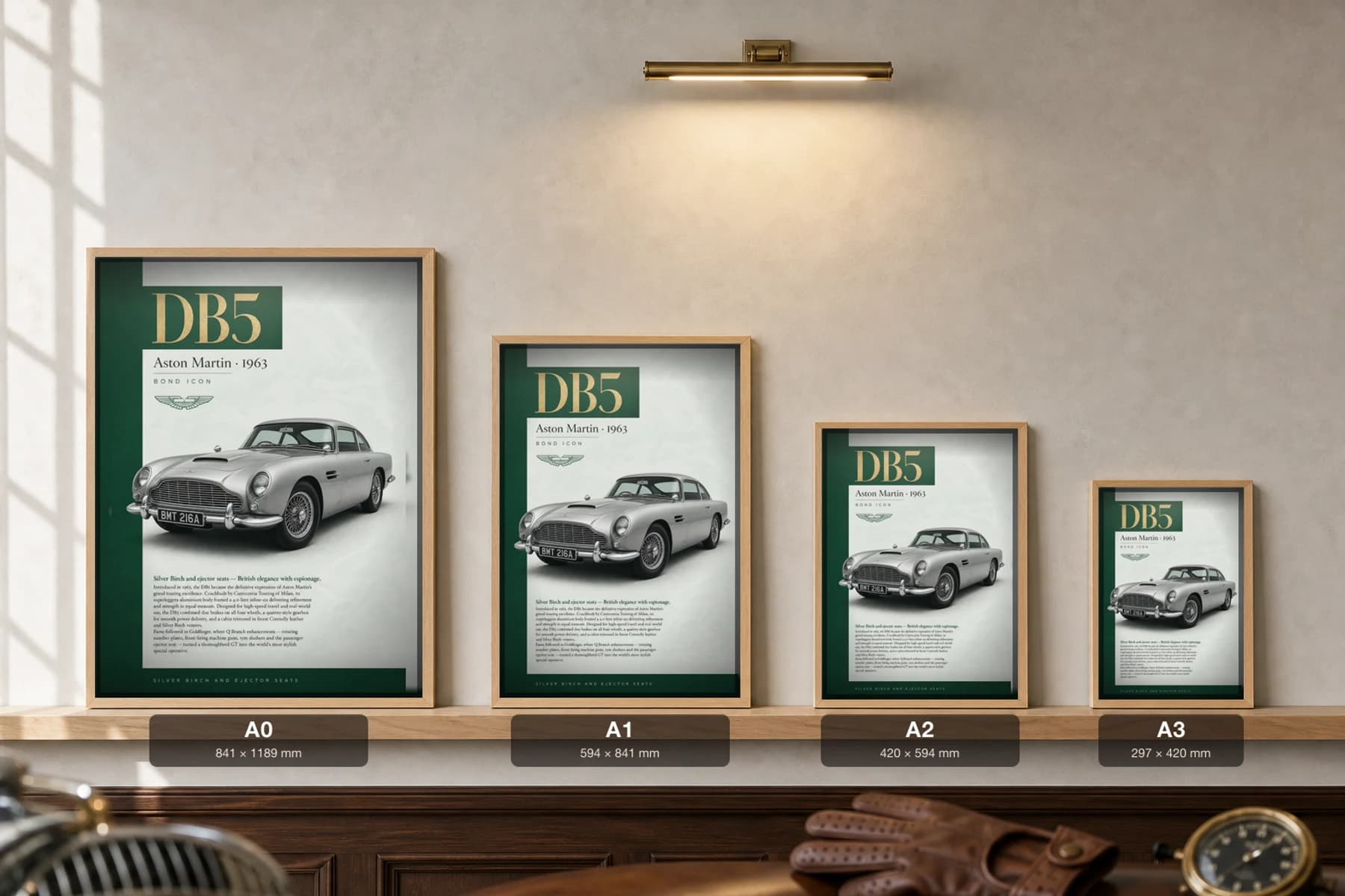 Aston Martin DB5 Poster — 1963 grand tourer wall art · framed A2 · garage decor — print size guide showing the artwork at A0, A1, A2 and A3 in natural-oak frames at true relative scale