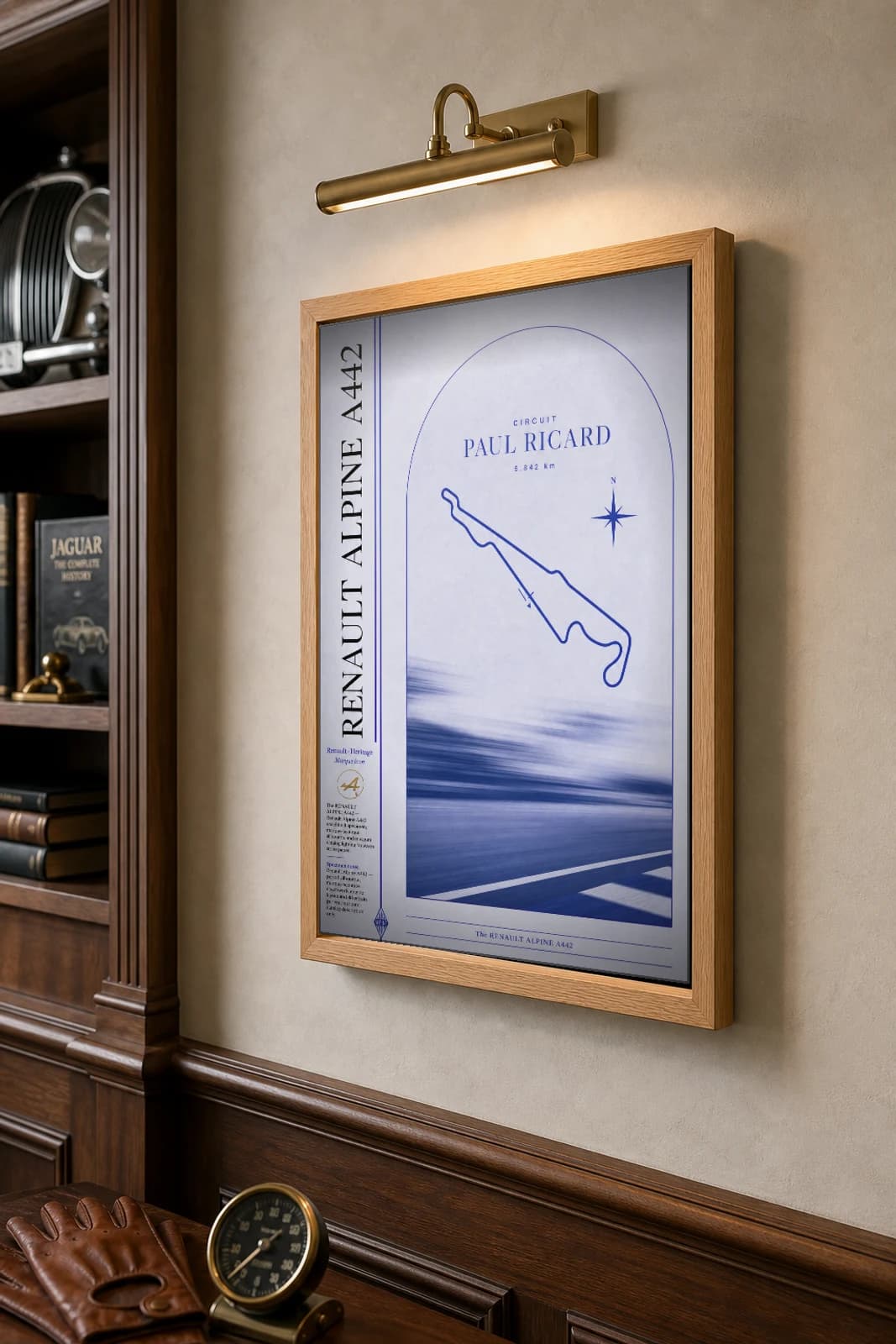 Renault Alpine A442 Poster — 1978 classic car wall art · framed A2 · garage decor — the framed print shown at a three-quarter angle on a styled gallery wall in a natural-oak frame