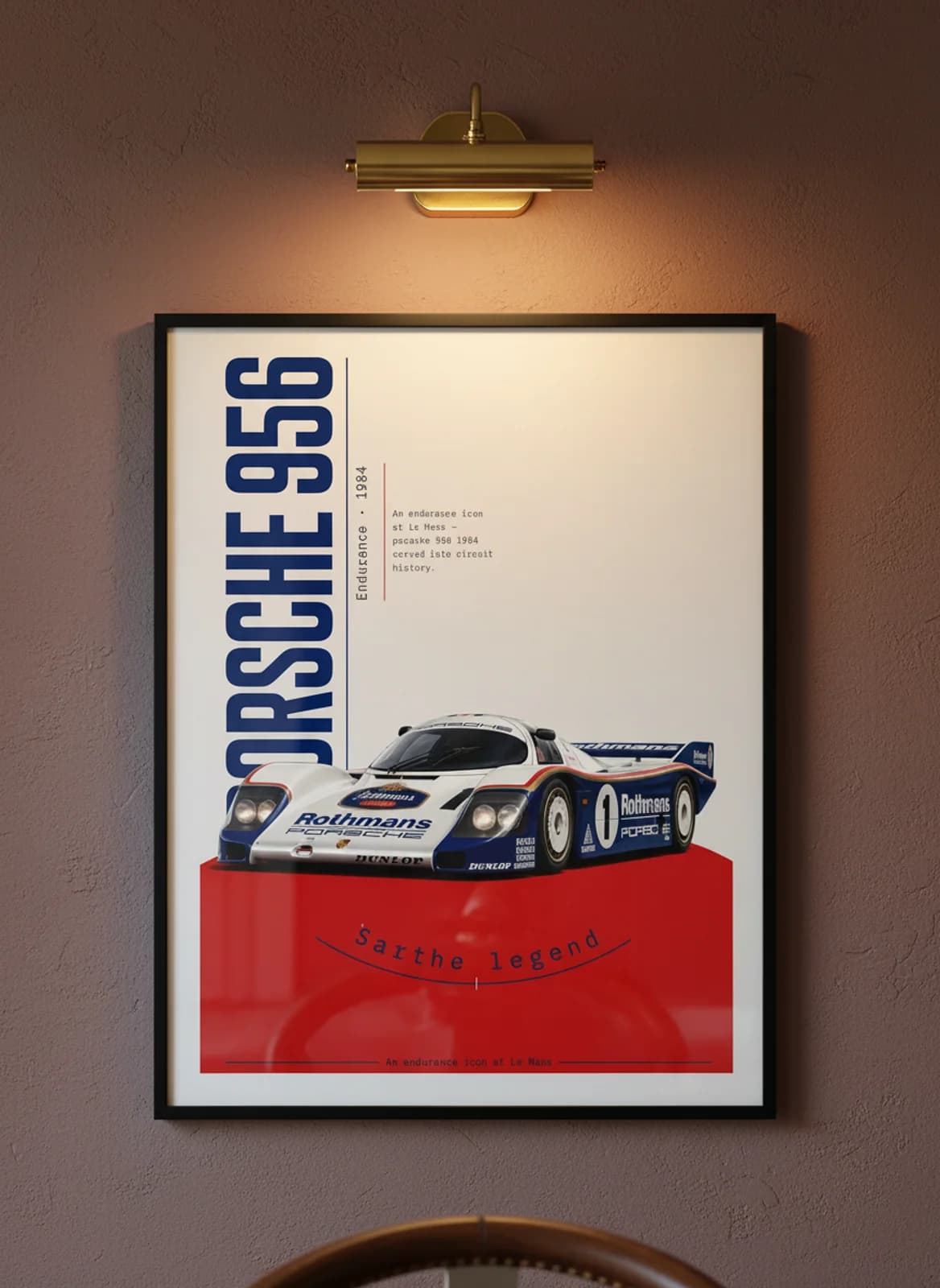 Porsche 956 Le Mans endurance print in black A2 frame on warm-cream-parchment oxblood wall — Le Mans mockup