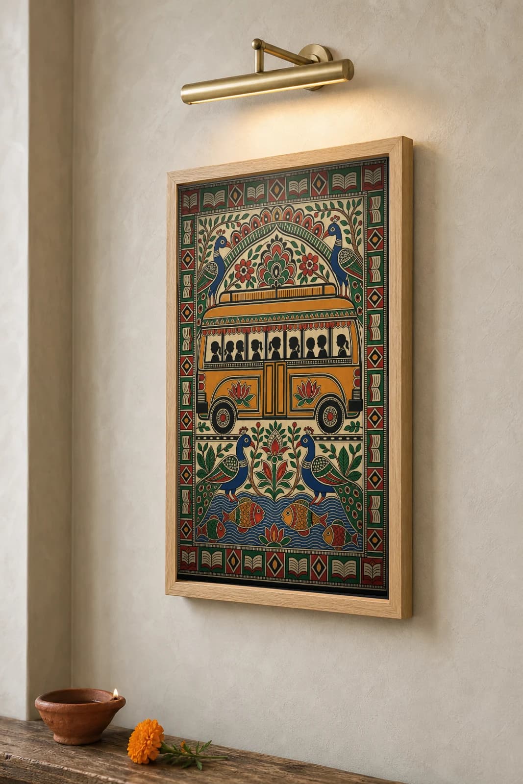 Rural School Bus Madhubani Poster — bharni Mithila folk art wall decor · framed A2 · Mithila (Bihar) grammar applied to Madhya Pradesh rural education and village-to-school transit — the framed print shown at a three-quarter angle on a styled gallery wall in a natural-oak frame