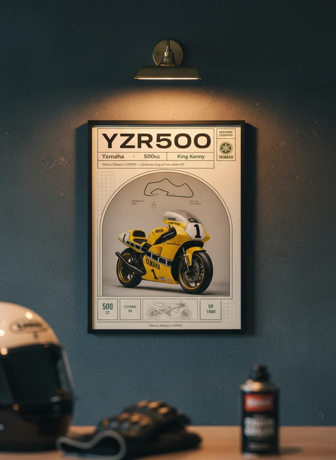 YZR500 MotoGP Legends print in black A2 frame on yamaha-blue charcoal garage wall — motorcycle lounge mockup