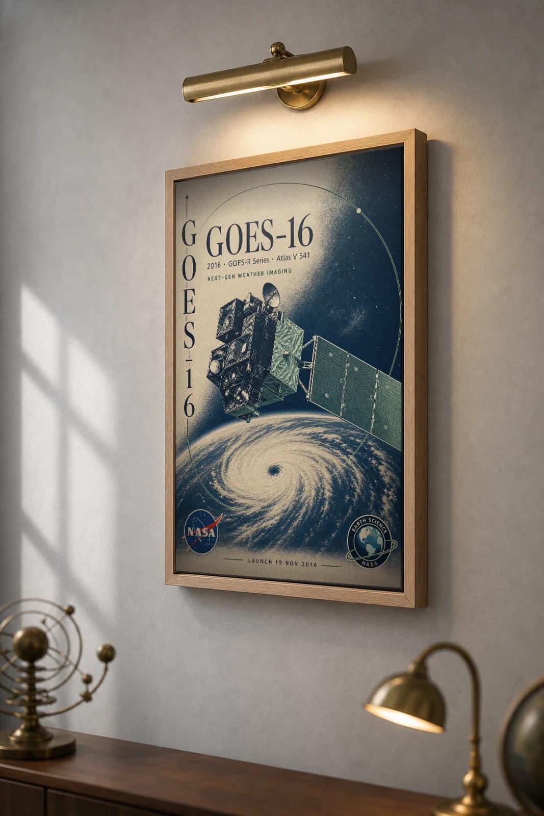 GOES-16 Poster — 2016 Next-Gen Weather Imaging NASA Heritage Collector Print — the framed print shown at a three-quarter angle on a styled gallery wall in a natural-oak frame