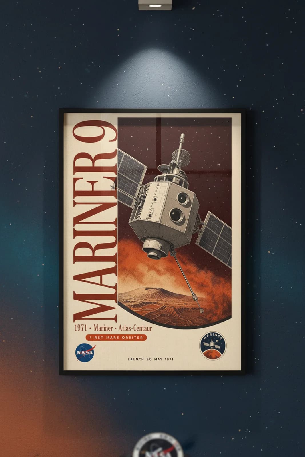 Mariner 9 poster in black A2 frame on rust-orange-mars-surface deep space navy wall — NASA Heritage collector study mockup