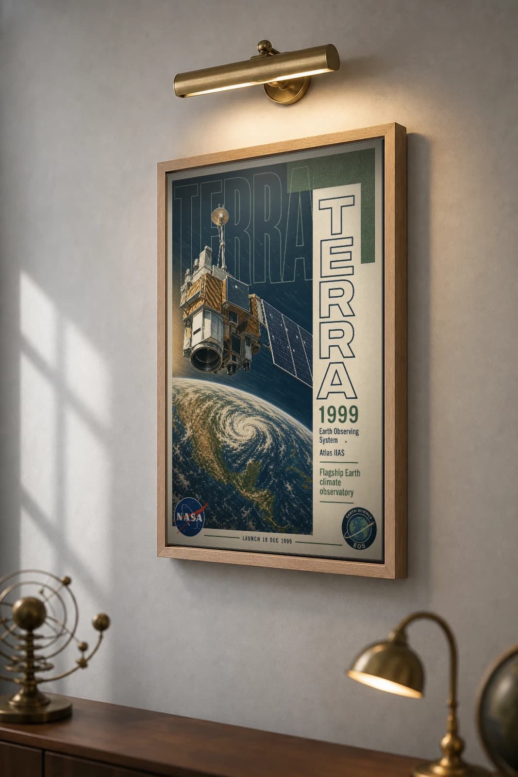 Terra Poster — 1999 Atlas IIAS EOS Flagship Climate Observatory NASA Heritage Collector Print — the framed print shown at a three-quarter angle on a styled gallery wall in a natural-oak frame