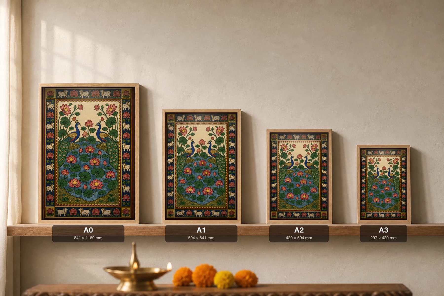 Kamal-Mayur Pichwai-Style Print — Two Peacocks Above a Lotus Tank · collector A2 · Nathdwara, Rajasthan cloth-painting tradition — print size guide showing the artwork at A0, A1, A2 and A3 in natural-oak frames at true relative scale