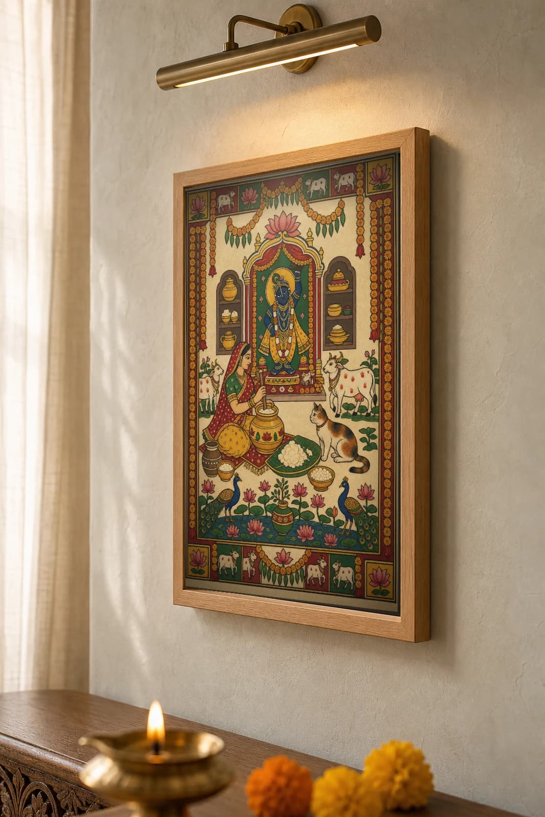 Makhan Bhog Pichwai-Style Print — Butter Offering at the Home Shrine · collector A2 · contemporary × Nathdwara Pichwai fusion — the framed print shown at a three-quarter angle on a styled gallery wall in a natural-oak frame