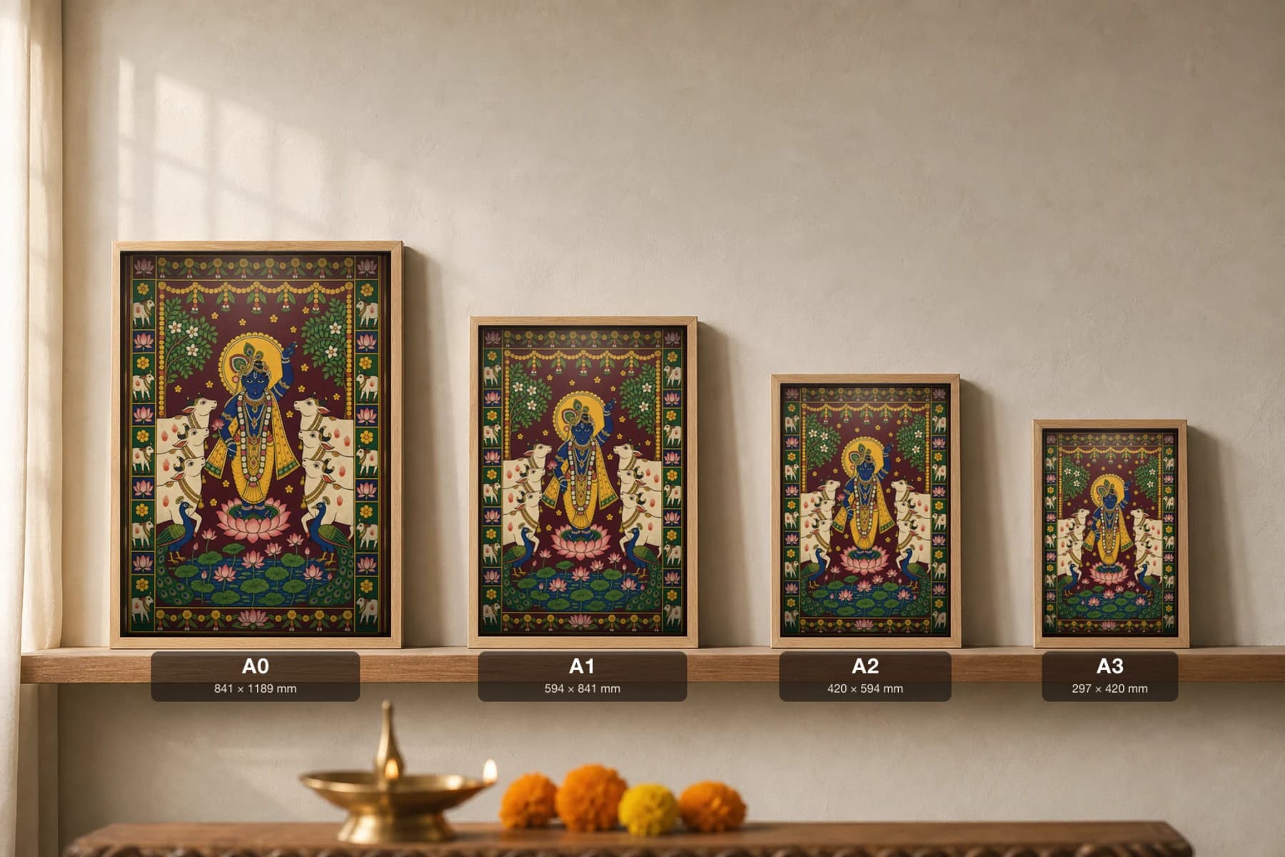 Go-Shringar Pichwai-Style Print — Shrinathji Ringed by His Beloved Cows · collector A2 · Nathdwara, Rajasthan cloth-painting tradition — print size guide showing the artwork at A0, A1, A2 and A3 in natural-oak frames at true relative scale