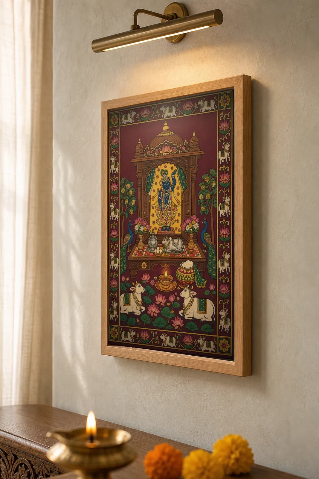 Ghar Ka Mandir Pichwai-Style Print — The Family's Dressed Thakurji Shrine · collector A2 · contemporary × Nathdwara Pichwai fusion — the framed print shown at a three-quarter angle on a styled gallery wall in a natural-oak frame