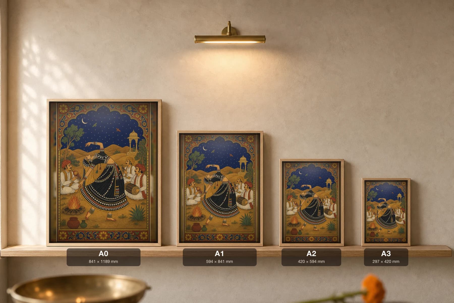 Kalbeliya Raat — Kalbeliya Night Dance Rajput Miniature Art Print · collector edition A2 · a serpent-skirted dancer arched back by a fire under the dunes and a crescent moon, Marwar grammar — print size guide showing the artwork at A0, A1, A2 and A3 in natural-oak frames at true relative scale