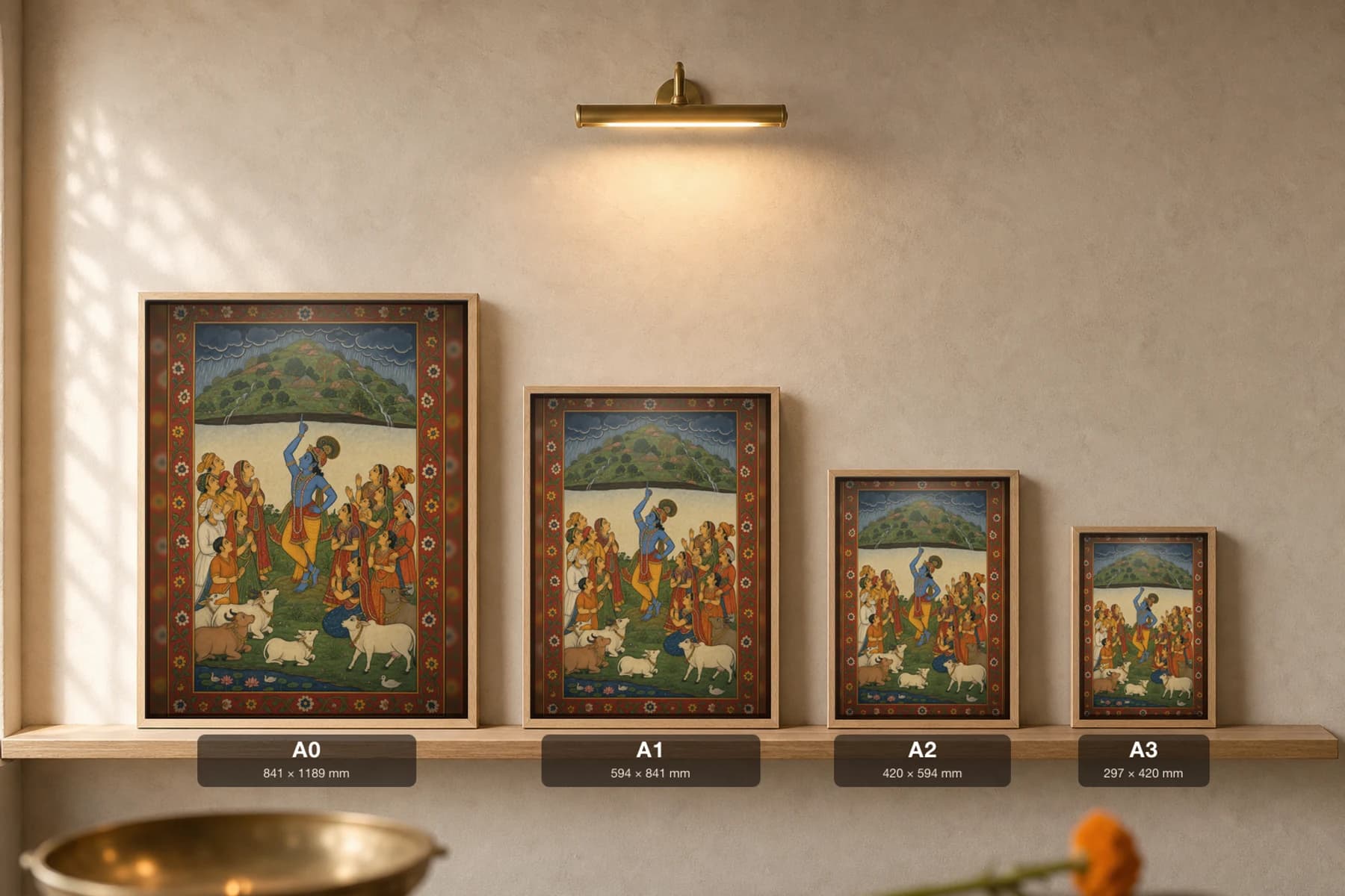 Govardhan Rajput Miniature Print — Mewar Krishna-lila, Krishna lifting the hill on one finger against the storm · collector edition A2 — print size guide showing the artwork at A0, A1, A2 and A3 in natural-oak frames at true relative scale
