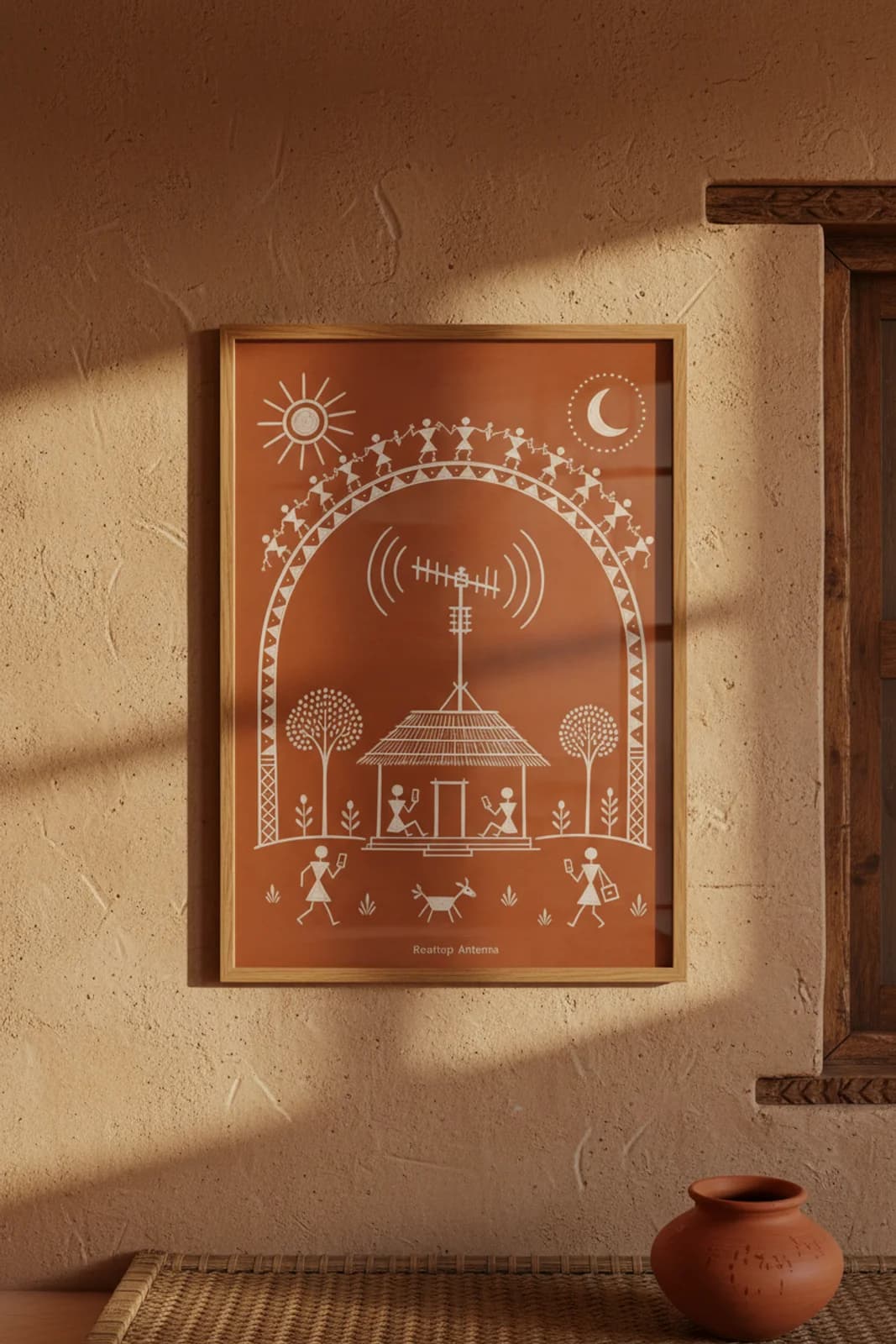 Rooftop Antenna Warli print in natural oak A2 frame on warm-earth-neutral mud-plaster wall — rustic Indian folk art mockup