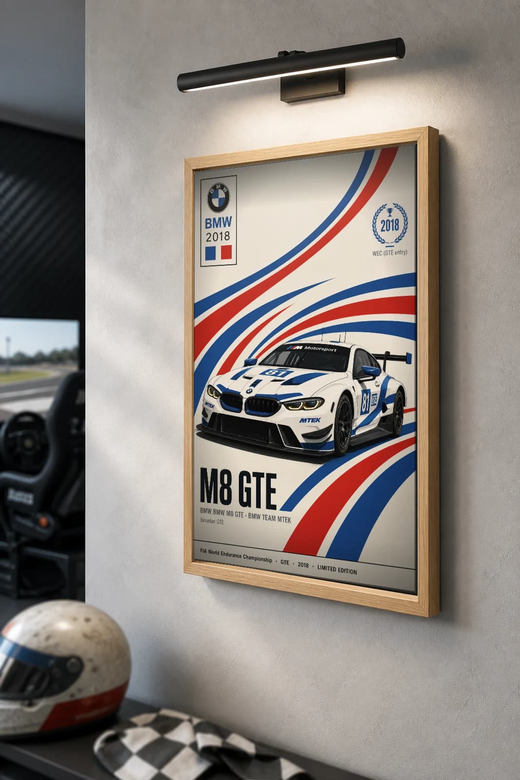 BMW Team MTEK M8 GTE Poster — 2018 GTE WEC racing wall art · #81 · framed A2 — the framed print shown at a three-quarter angle on a styled gallery wall in a natural-oak frame